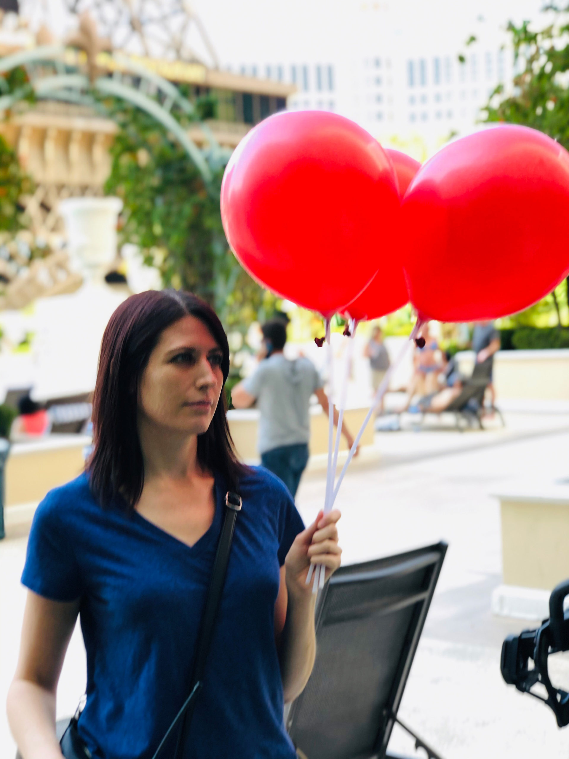 Amanda on set with red balloons